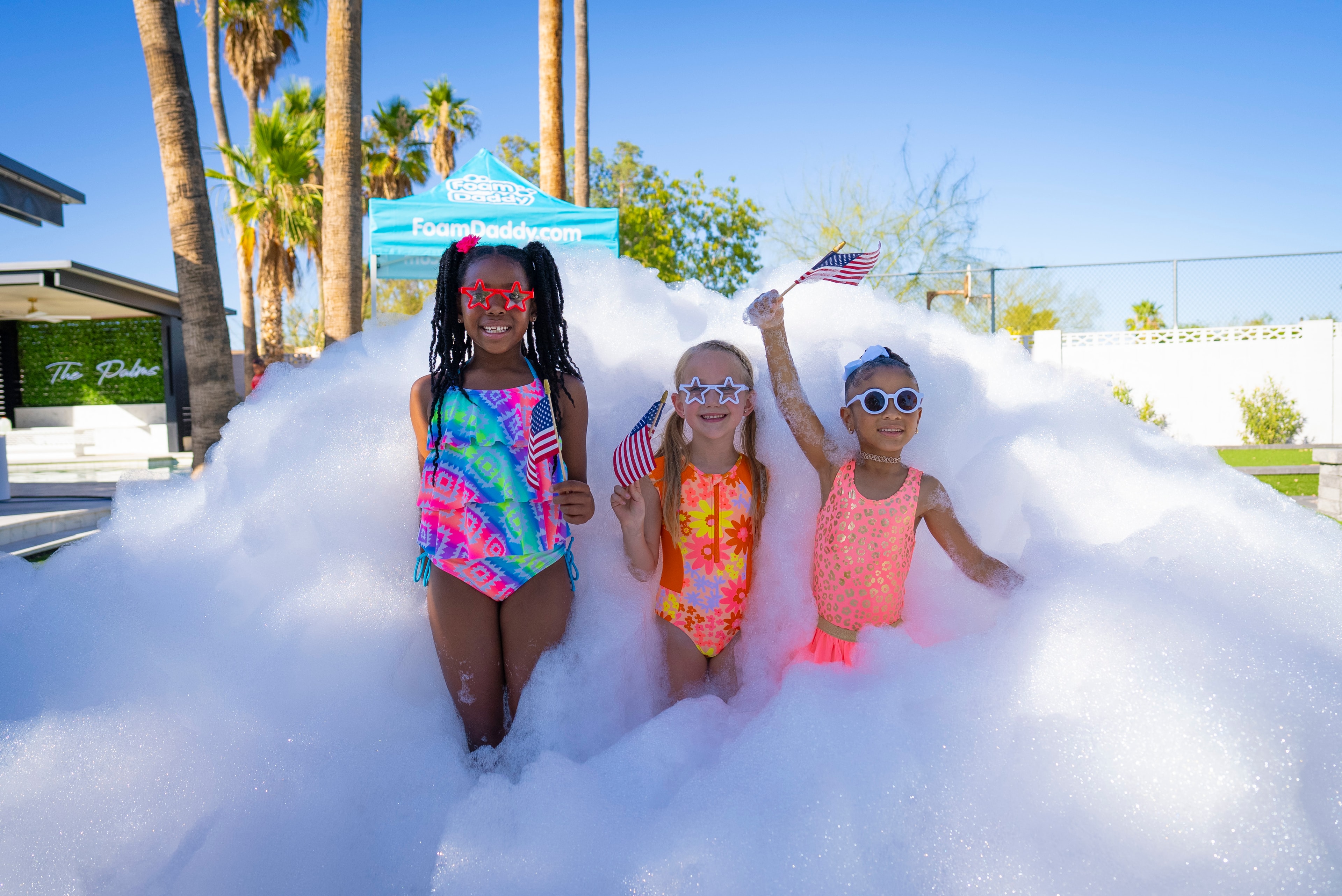 Three little girls with American flags in foam