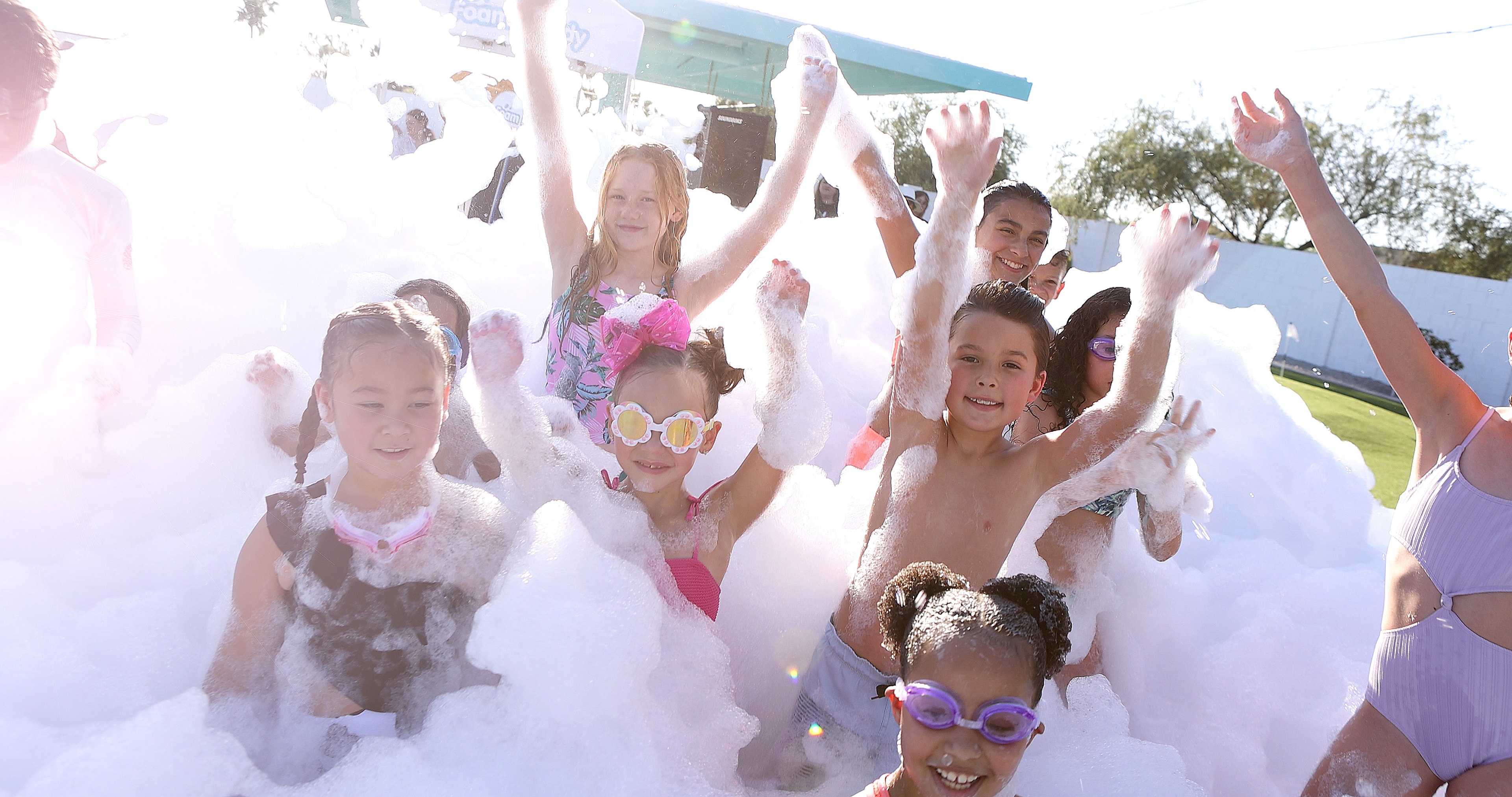 Kids playing in pink foam